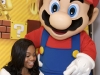 In this photo provided by Nintendo of America, Olympic gold medalist Gabrielle Douglas competes for a new kind of gold in New Super Mario Bros. 2 on Nintendo 3DS at Nintendo World in New York on Sept. 25, 2012. As a longtime Super Mario Bros. fan, Douglas partnered with Nintendo for its new âPlay As You Areâ campaign, which is designed to show that girls do not need to be hard-core gamers to enjoy Nintendo 3DS; the system offers video games suited for a wide range of interests and personalities.
