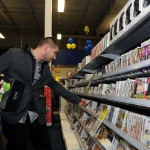In this photo provided by Nintendo of America, Armand M. of Van Nuys, Calif. searches the shelves at the Best Buy Burbank, Calif., store in pursuit of Wii software during a Black Friday shopping trip on Nov. 25, 2011. Best Buy opened up its stores at 12:01 a.m. nationwide to give consumers a head start on holiday savings. (AP Photo/Nintendo, Bob Riha, Jr.) No Sales