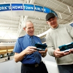 In this photo provided by Nintendo of America Inc., JetBlue pilot Rick Wright from Flower Mound, TX, plays the Pilotwings Resort game for the new Nintendo 3DS system alongside Francois Boilard from Quebec, Canada while at JetBlue’s Terminal 5 in New York’s John F. Kennedy International Airport on April 22, 2011. Available now at retailers across the U.S., the Nintendo 3DS gives users the ability to take 3D photos and play 3D games without the need for special glasses. (Anders Krusberg for Nintendo of America)