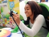 In this photo provided by Nintendo of America and released June 7, 2014, Teoko P.,17, of Los Angeles plays "YoshiÕs New Island" in a Yoshi egg-shaped seat at the Westfield Culver City mall on June 6, 2014, as part of the ÒPlay Nintendo Tour 2014,Ó which kicked off in Los Angeles on June 6. The free three-month tour will visit malls and events in a dozen major cities across the United States. Nintendo 2DS is an ideal first-time system. (Photo by Nintendo/Bob Riha, Jr.)